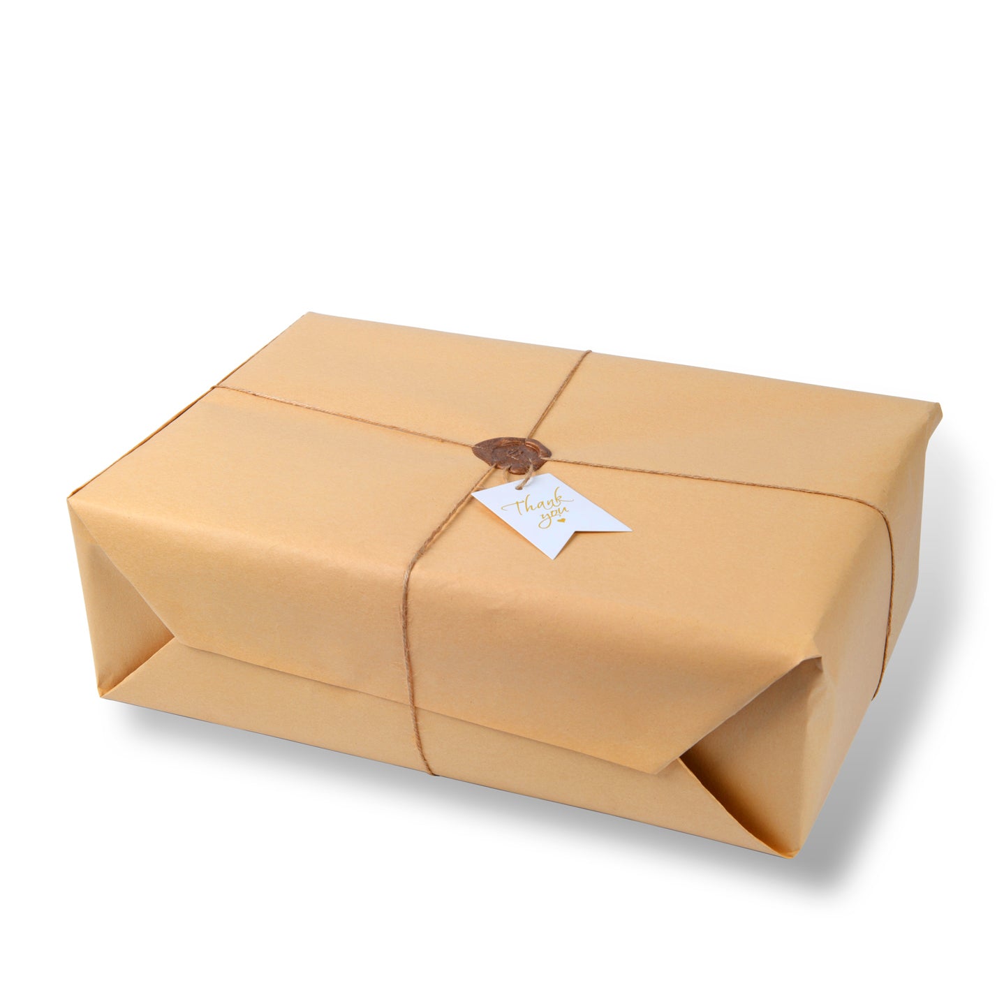 Gift box wrapped in brown paper with a white tag on a white background