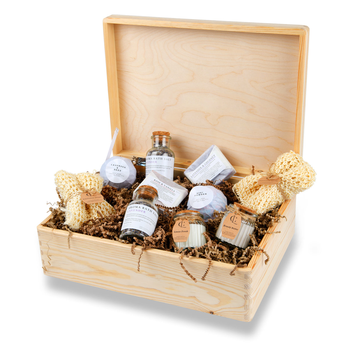 Wooden gift box with skincare products and natural items on a white background
