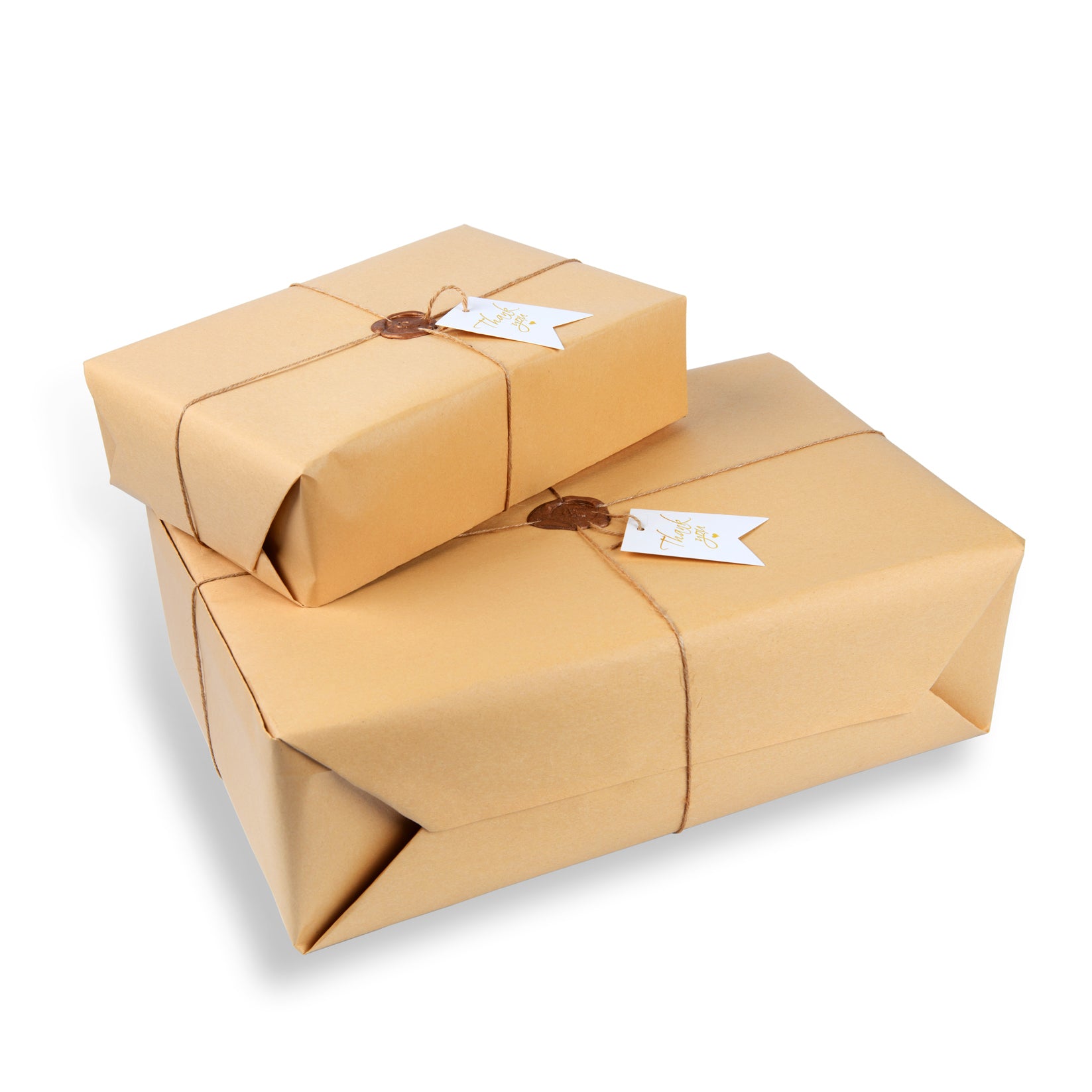 Two brown gift boxes with tags on a white background