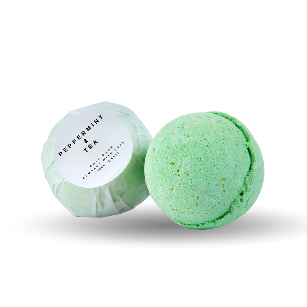 Green bath bomb with a white label on a white background