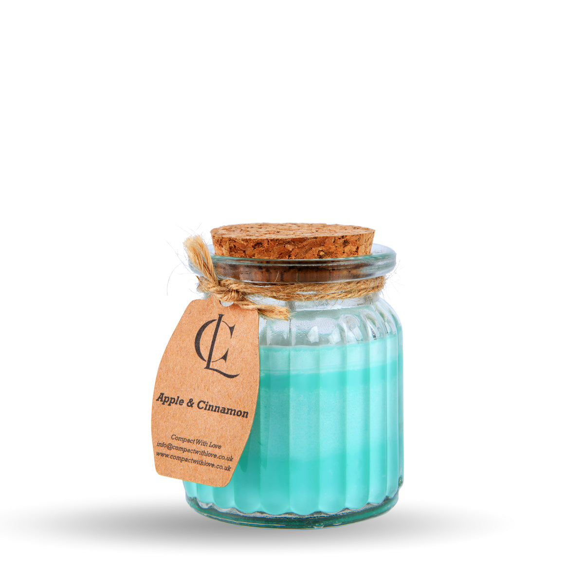 Glass jar candle with a cork lid and a label on a white background