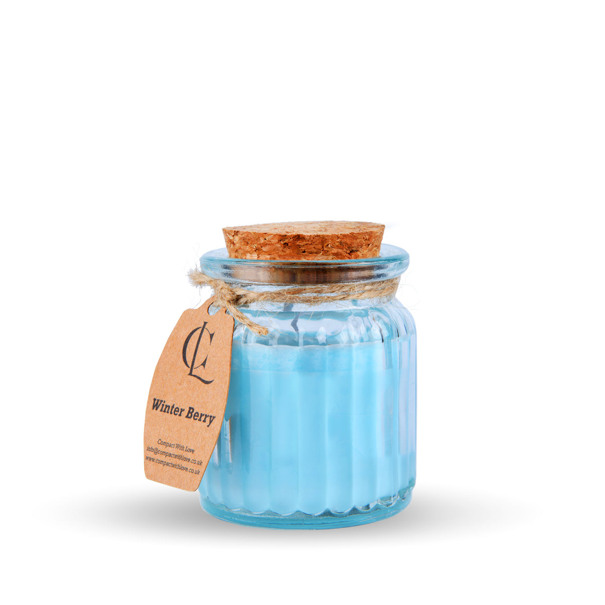 Blue candle in a glass jar with a cork lid on a white background