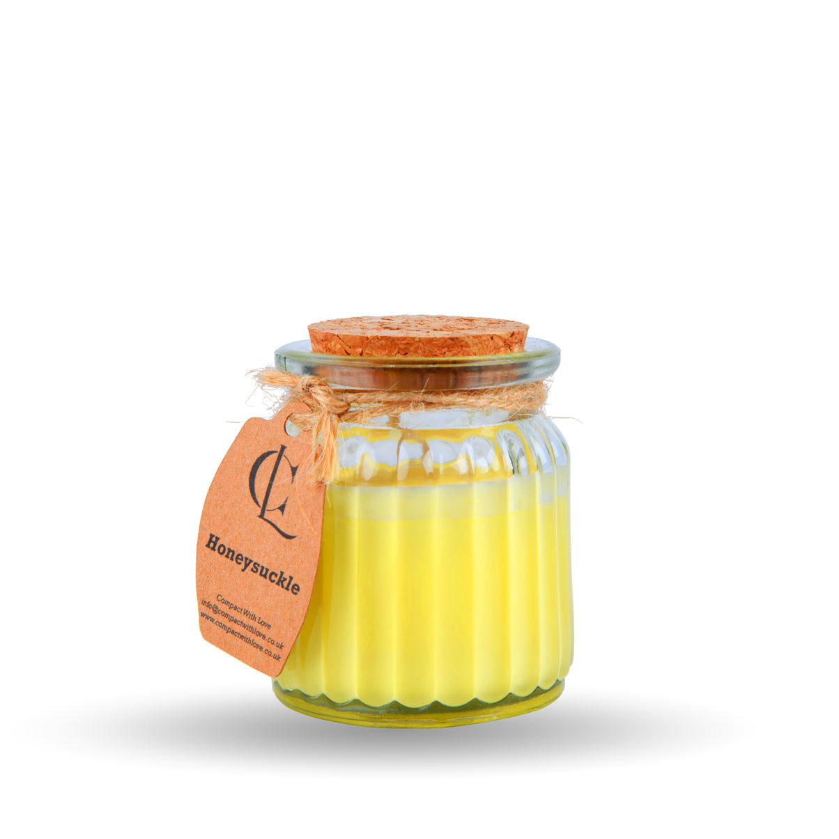 Yellow candle in a glass jar with a cork lid on a white background