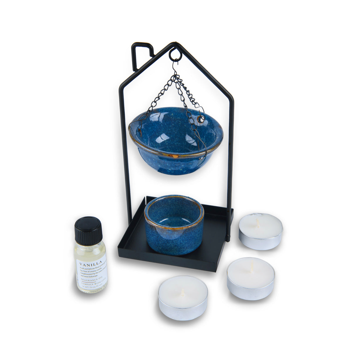 Set with blue ceramic bowls, black stand, and candles on a white background